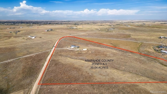 birds eye view of property featuring a rural view