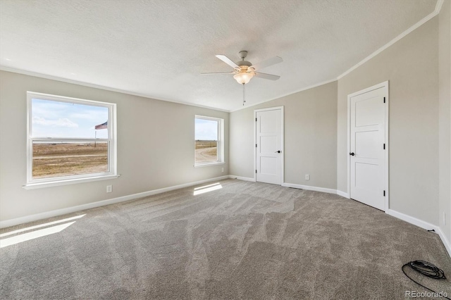 43343 E Arkansas Pl, Bennett, CO 80102 - unfurnished bedroom with carpet flooring, baseboards, crown molding, a textured ceiling, and a ceiling fan