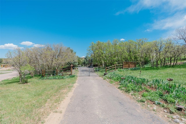 view of street featuring a gate and a rural view