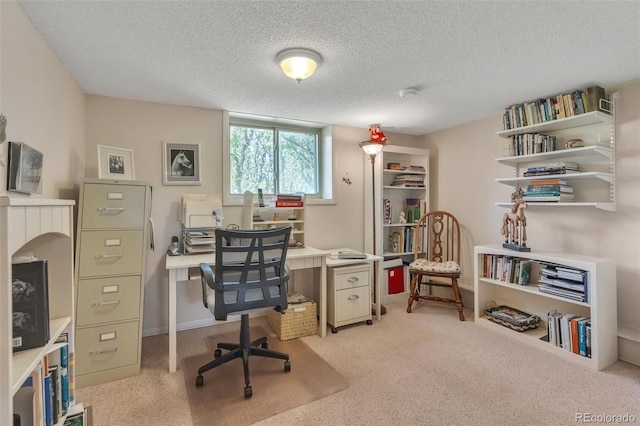 office space with light carpet and a textured ceiling