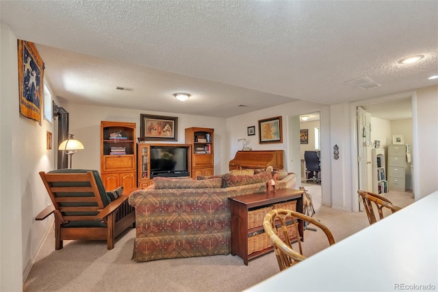 living room with light carpet and a textured ceiling