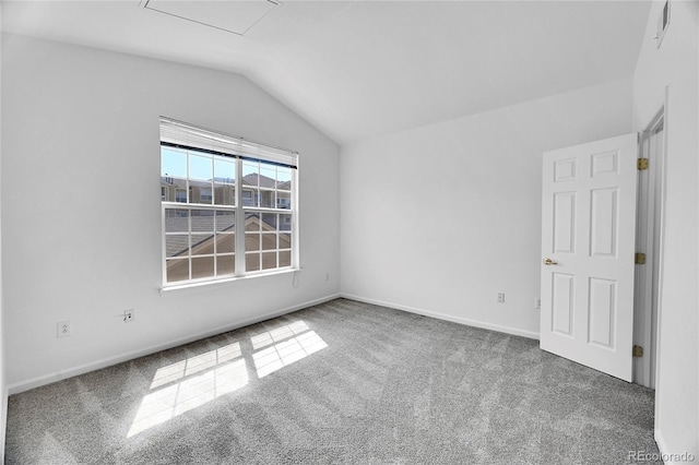 unfurnished room with lofted ceiling and carpet