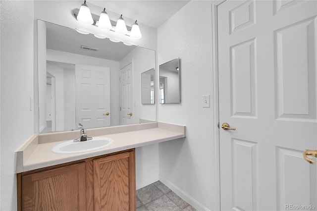 bathroom with vanity and tile patterned floors