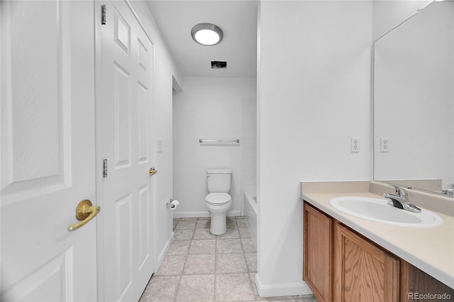 bathroom featuring vanity, tile patterned flooring, and toilet