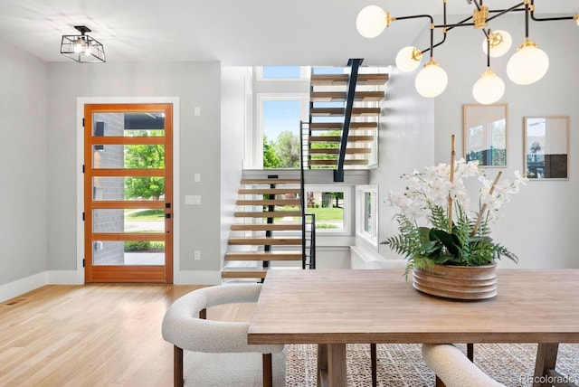 1500 S Elizabeth St, Denver, CO 80210 - dining area featuring light wood-style floors, plenty of natural light, and baseboards