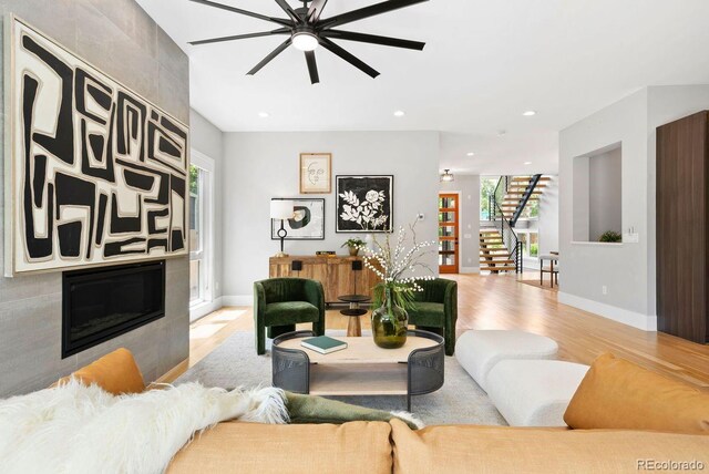 1500 S Elizabeth St, Denver, CO 80210 - living room featuring light wood-style flooring, ceiling fan, baseboards, stairway, and recessed lighting