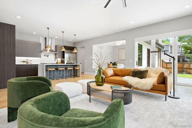 1500 S Elizabeth St, Denver, CO 80210 - living area featuring plenty of natural light, recessed lighting, light wood-style floors, and baseboards