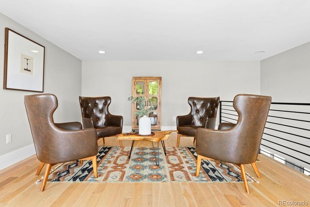 1500 S Elizabeth St, Denver, CO 80210 - living area featuring wood finished floors, baseboards, and recessed lighting