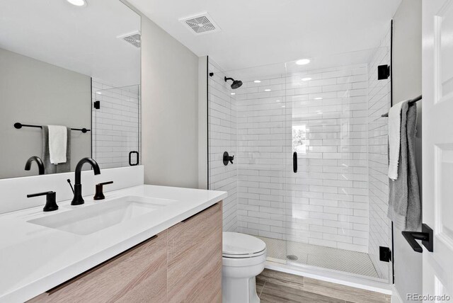 1500 S Elizabeth St, Denver, CO 80210 - full bath with vanity, toilet, a stall shower, and recessed lighting