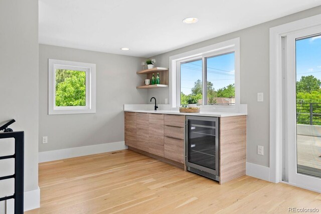 1500 S Elizabeth St, Denver, CO 80210 - indoor wet bar featuring wine cooler, light wood finished floors, baseboards, and recessed lighting