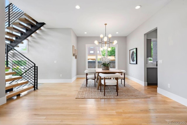 1500 S Elizabeth St, Denver, CO 80210 - dining space featuring stairs, a chandelier, baseboards, light wood-style floors, and recessed lighting