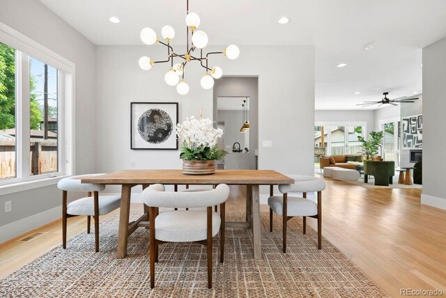 1500 S Elizabeth St, Denver, CO 80210 - dining area with wood finished floors, recessed lighting, baseboards, a chandelier, and ceiling fan