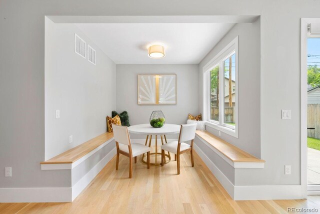 1500 S Elizabeth St, Denver, CO 80210 - dining area featuring wood finished floors, breakfast area, and baseboards