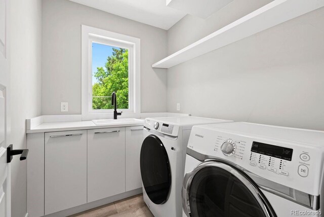 1500 S Elizabeth St, Denver, CO 80210 - washroom with washer and dryer and cabinet space