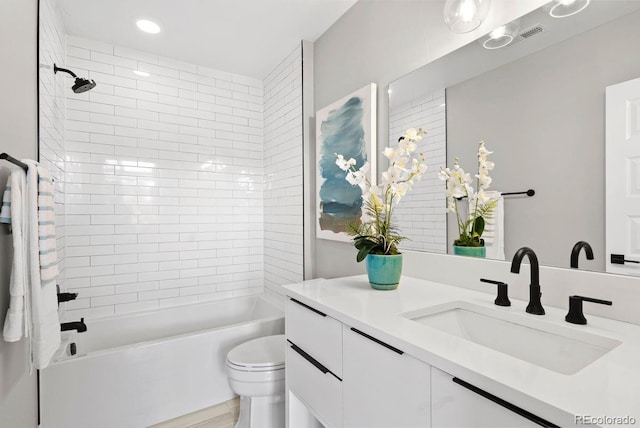 1500 S Elizabeth St, Denver, CO 80210 - bathroom with vanity, toilet, bathing tub / shower combination, and recessed lighting
