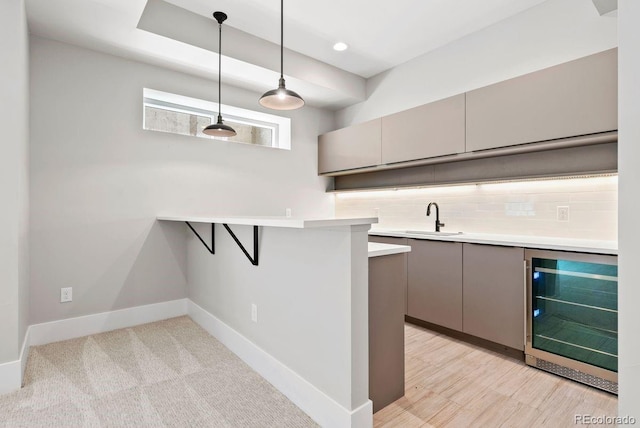 1500 S Elizabeth St, Denver, CO 80210 - kitchen with wine cooler, a sink, gray cabinetry, decorative backsplash, and light countertops