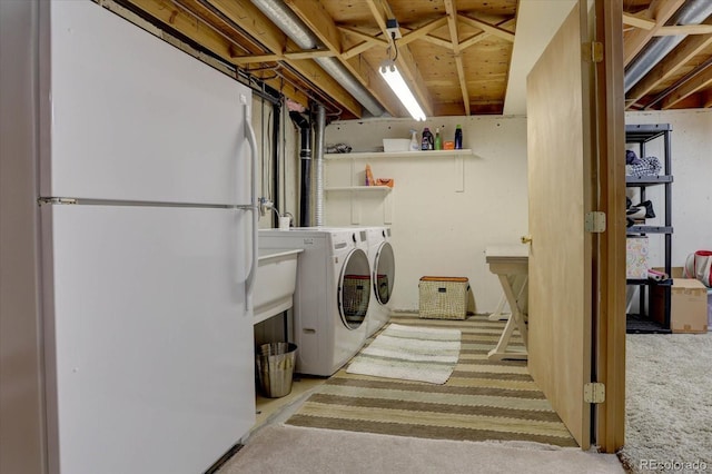 clothes washing area featuring laundry area and separate washer and dryer