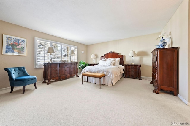 carpeted bedroom with baseboards