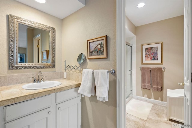 bathroom with a stall shower, tile patterned flooring, vanity, and recessed lighting