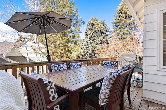 deck with outdoor dining area