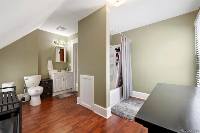 full bathroom with lofted ceiling, shower / bath combination with curtain, hardwood / wood-style flooring, vanity, and toilet