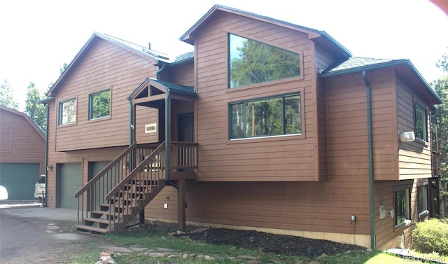 9274 Sandy Ln, Conifer, CO 80433 - view of front of home with an attached garage and driveway