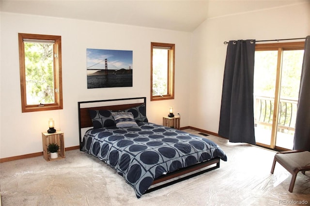 9274 Sandy Ln, Conifer, CO 80433 - carpeted bedroom featuring access to outside, baseboards, and vaulted ceiling
