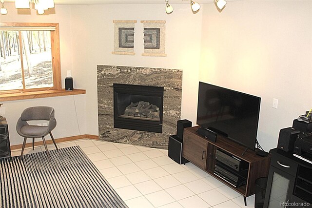 9274 Sandy Ln, Conifer, CO 80433 - living area with a high end fireplace, tile patterned floors, and track lighting