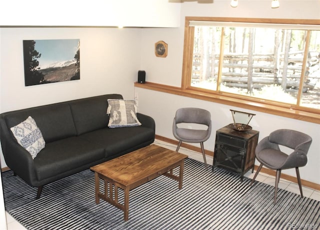 9274 Sandy Ln, Conifer, CO 80433 - tiled living area with baseboards