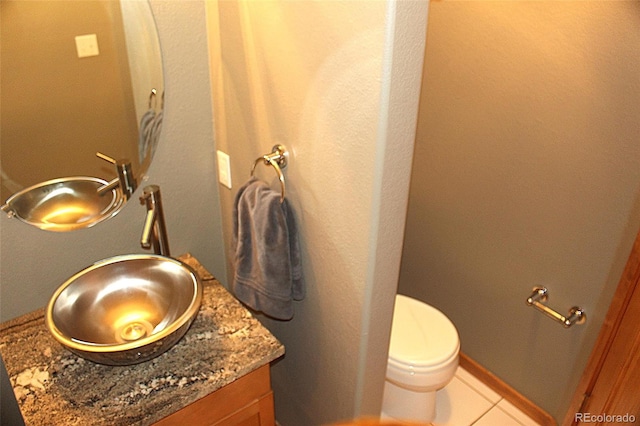 9274 Sandy Ln, Conifer, CO 80433 - half bathroom featuring tile patterned floors, vanity, and toilet