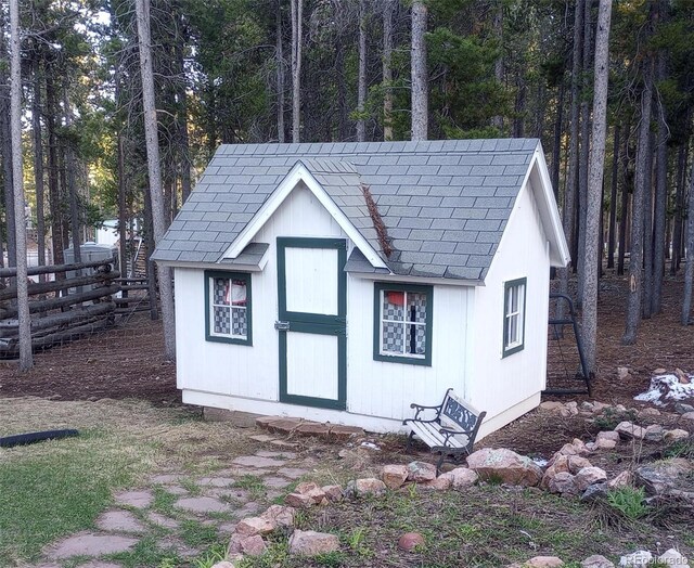 9274 Sandy Ln, Conifer, CO 80433 - view of outdoor structure with fence and an outbuilding