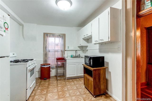 kitchen featuring white cabinets, sink, white appliances, and light parquet floors