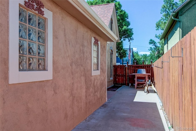 view of side of home with a patio