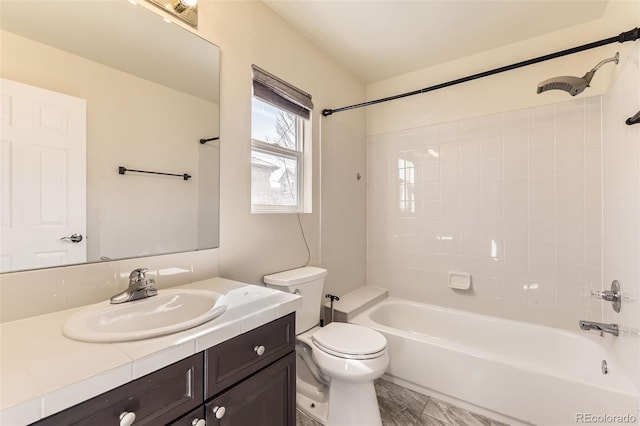 bathroom featuring toilet, shower / tub combination, and vanity