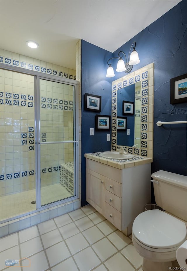 7022 Secrest Ct, Arvada, CO 80007 - full bathroom with a stall shower, vanity, and toilet
