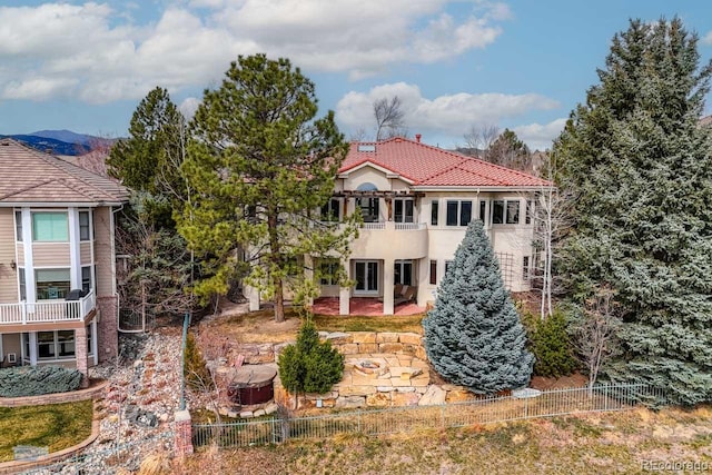 7022 Secrest Ct, Arvada, CO 80007 - exterior space with stucco siding, fence, a patio, and a tiled roof