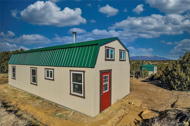 4178 County Road 504, Walsenburg, CO 81089 - view of side of home featuring a gambrel roof, a mountain view, and metal roof