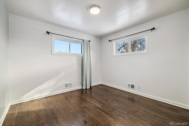 empty room featuring dark hardwood / wood-style floors