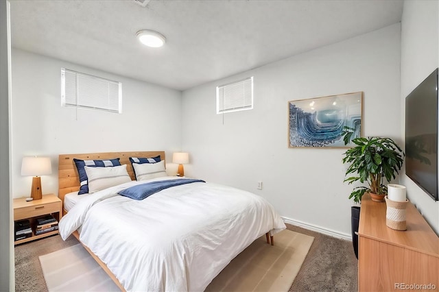 bedroom with dark carpet