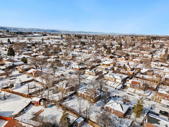 snowy aerial view with a residential view