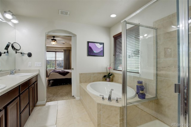 bathroom featuring vanity, shower with separate bathtub, ceiling fan, and tile patterned flooring