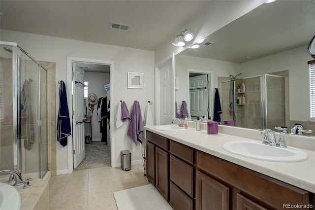 bathroom with vanity, independent shower and bath, and tile patterned floors