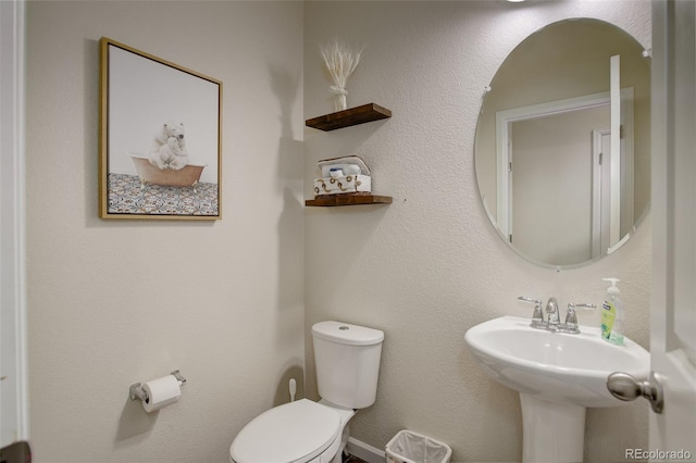 bathroom with sink and toilet