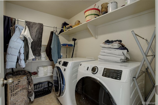 clothes washing area featuring independent washer and dryer and light tile patterned floors