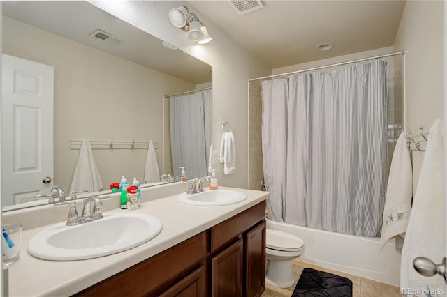 full bathroom featuring vanity, shower / bath combination with curtain, toilet, and tile patterned floors