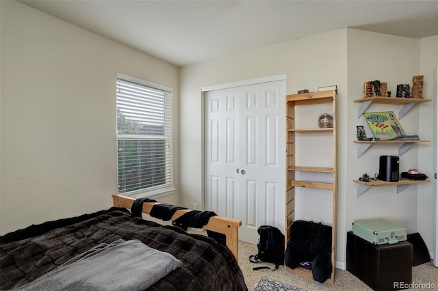 carpeted bedroom featuring a closet