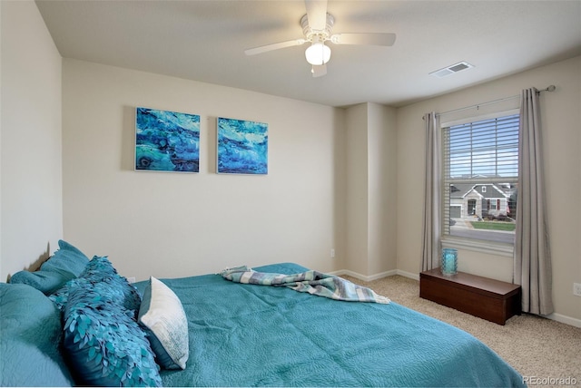 bedroom with light colored carpet and ceiling fan