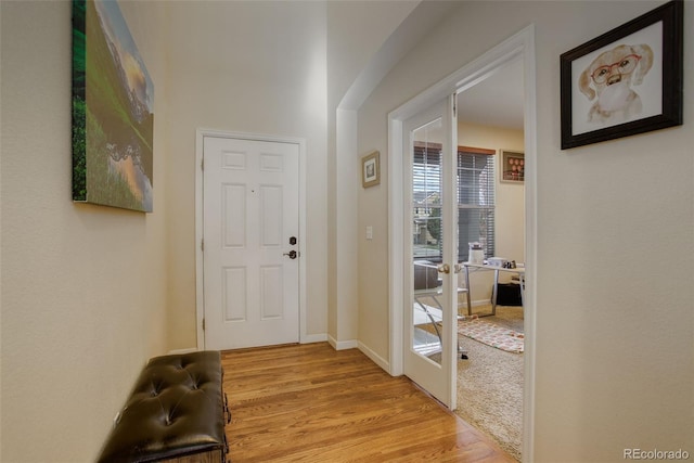 interior space featuring french doors and light hardwood / wood-style flooring