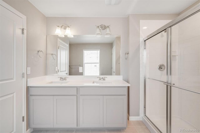 bathroom with vanity, tile patterned floors, and a shower with shower door