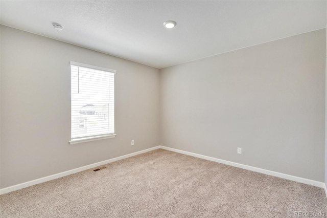 spare room with carpet flooring